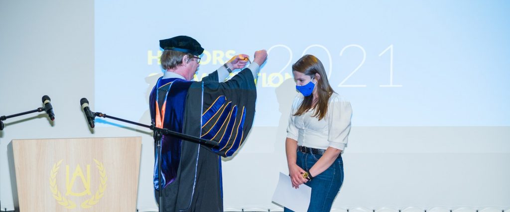 President Dr. David R. Evans and 2021 Presidential Medalist Arlinda Osmanoviq