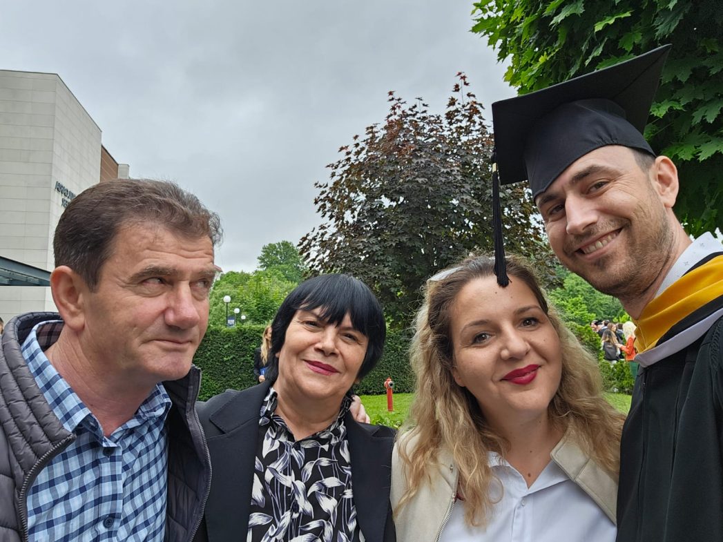 AUBG alumnus Taulant Mecaj ('24) with his family during his commencement ceremony