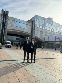 AUBG student Ben Whyman in front of the European Parliament with a friend